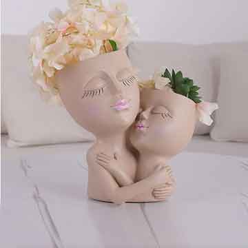 Maceta de caras divertidas Tita Dong, en Amazon.